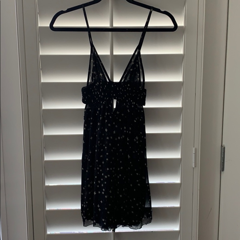 Indah star print  dress with cut outs . XS